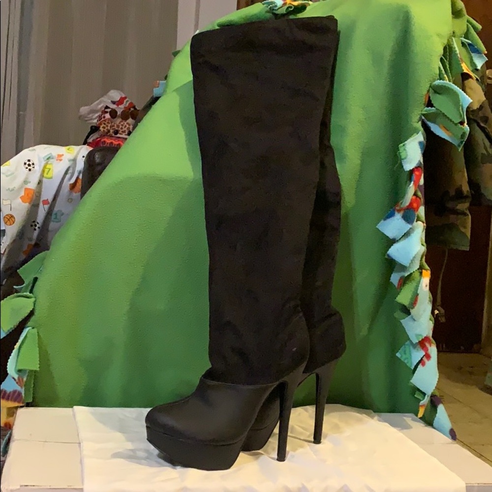 Black thigh high boots. Vegan
